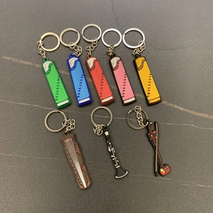 Detail shot of mini traditional musical instrument keychains in various colors and shapes