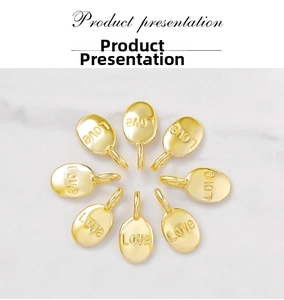 Detailed view of eight oval gold pendants with Love engraving for DIY jewelry making
