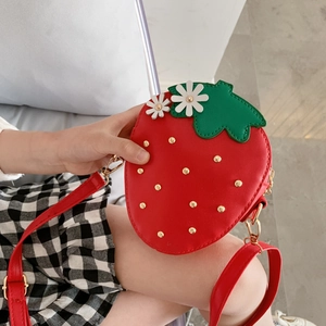 Cute red strawberry shaped crossbody bag with gold studs and green leaf details for girls