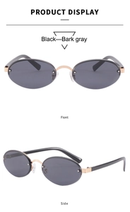 Macro detail of rimless oval sunglasses with golden metal bridge and dark gray lenses
