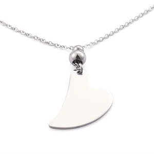 Close-up of a silver minimalist heart pendant necklace with polished metal surface