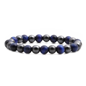Macro detail of natural tiger eye and hematite beaded bracelet on white background