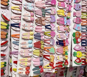 Macro detail of various colorful resin hair clips and patterns for kids on cards