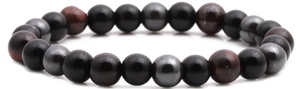 Macro shot of multi-color tiger eye and hematite beaded bracelet on white background