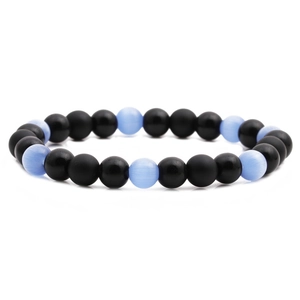DIY bead bracelet kit featuring matte black stones and light blue cat-eye beads on white