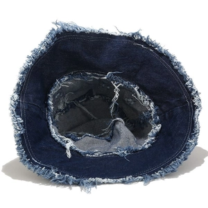 Retro washed dark blue denim bucket hat with frayed edges and street style design