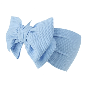 Light blue waffle knit baby headband with large bow for infants and toddlers