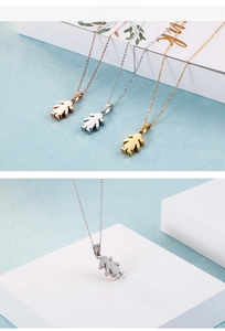Detailed view of cartoon girl silhouette pendants in rose gold, silver, and gold finishes