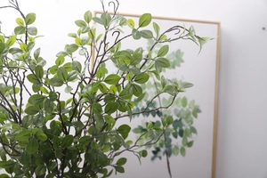 Detailed close-up of realistic faux Milan leaves with textured green foliage and stems