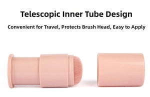 Detail of retractable makeup brush with pink casing and soft bristles for travel