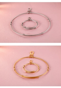 Detail view of gold and silver infinity symbol necklace and bracelet set on pink background