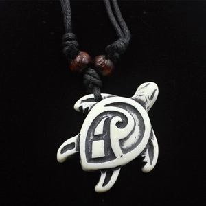 Carved faux bone turtle pendant necklace with wooden beads and adjustable black cord