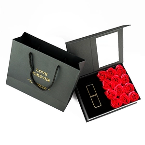 Close-up of black Valentine gift box with 12 soap roses and a matching paper tote bag