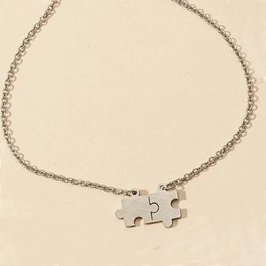 Polished stainless steel puzzle piece necklaces for couples with brushed metal finish
