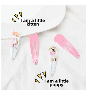 Set of four cute pet-themed hair clips featuring cat and dog prints in pink and white
