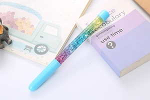 Detailed macro view of creative liquid sand gel pen with vibrant gradient glitters