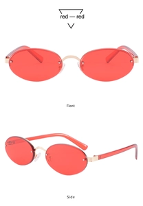 Detail view showing front and side profile of red oval rimless sunglasses with gold temples