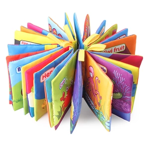 Washable baby cloth book set featuring soft fabric pages with ocean animals and fruit themes