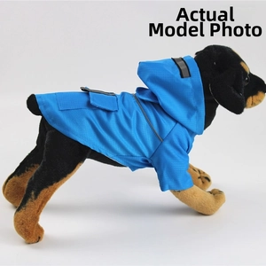 Detail showing blue pet raincoat with waterproof fabric and safety reflective strip