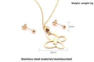 Detail of 18K gold plated stainless steel butterfly necklace and 4mm ball stud earrings set