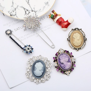 Vintage style brooch set with embossed portraits and rhinestone snowflake designs