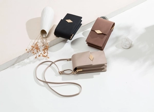 Three-layer accordion crossbody phone bag with quilted texture and gold metal buckle detail