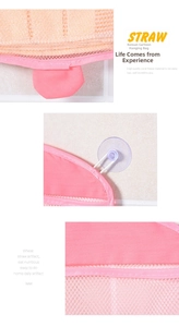 Detail of pink cartoon bath storage bag with coral fleece material and mesh pocket