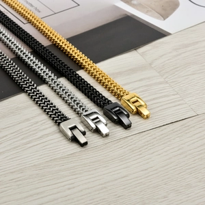 Men's stainless steel dragon bone chain bracelets in gold, black, and silver finishes