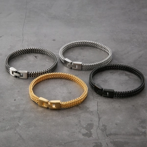 Detail showing four dragon bone chain bracelets in black, silver, gold, and grey finishes
