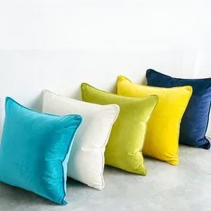 Close-up of square faux rabbit fur plaid pillow covers in five vibrant solid colors