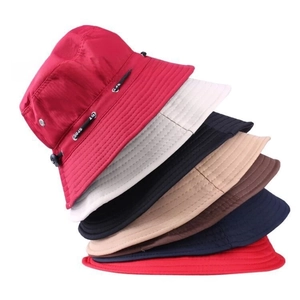 Detail of multi-color bucket hats showing reinforced brim stitching and SPORT label