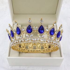 Baroque bridal crown with blue teardrop crystals and gold base in a gift box