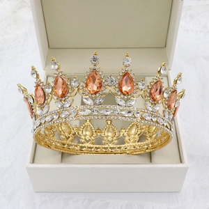 Detailed shot of golden baroque crown with champagne crystals in a luxury gift box