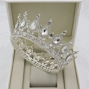 Macro view of silver bridal crown with teardrop crystals in a jewelry box