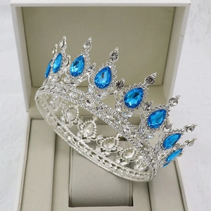 Detail of silver bridal crown with blue teardrop gemstones and sparkling rhinestones