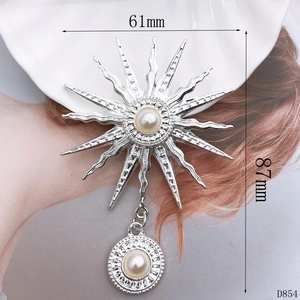 Detailed view of silver sunburst flower pendant with pearls showing 61mm by 87mm size