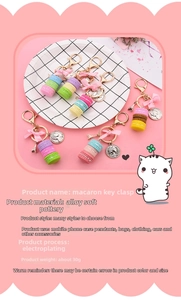 Detailed view of colorful layered macaron cake keychains with pink bows and Eiffel tower charms