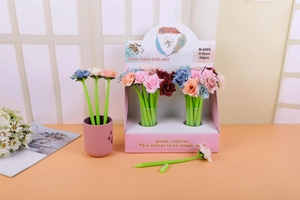 Detailed close-up of colorful rose-shaped silicone pens in a display box with 0.5mm tips