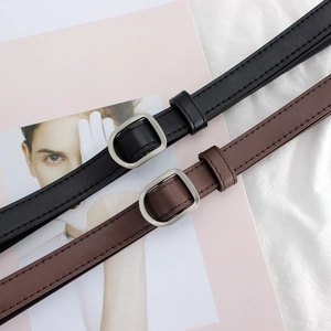 Minimalist D-ring narrow leather belt for women in black and brown with silver metal buckle