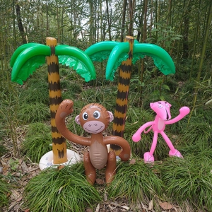 Outdoor inflatable palm trees with a monkey and pink leopard for beach party decor