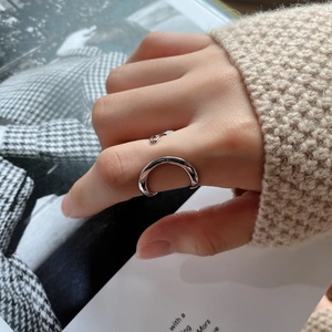 Irregular 925 sterling silver double-line ring styled on finger with knit sweater