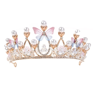 Golden princess crown with butterfly crystal accents and pearls for girls' stage hair styling