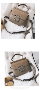 Detail of khaki frosted leather crossbody bag with metal buckle and wide strap