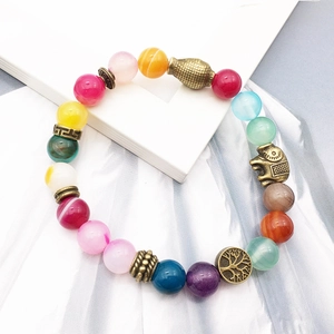 Colorful agate beaded bracelet featuring brass elephant and tree of life charms