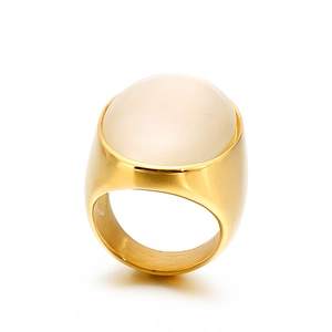 Fashionable gold titanium steel ring with an oval cat-eye stone inlay on white background