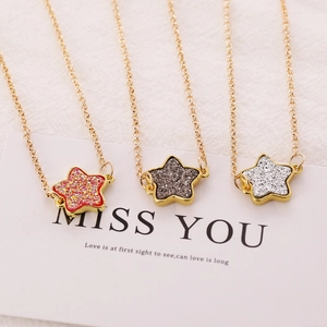 Three colorful star necklaces on gold chains with Miss You card, high quality aesthetic view