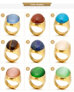 Nine oval cabochon stone rings in polished gold-finish stainless steel color display