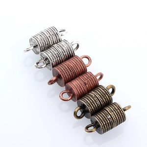 Detailed macro of vintage alloy magnetic jewelry clasps in silver, copper and bronze colors