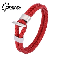 Close-up of a red double-layer braided leather bracelet featuring a silver metal anchor clasp
