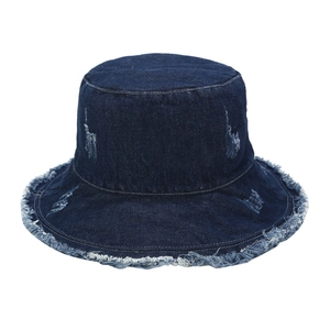 Vintage dark blue distressed denim bucket hat with frayed edges and street style holes